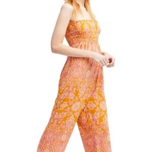 Free People orange mulit colored jumper, size Medium